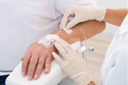 IV Drip inserted in a patient's arm