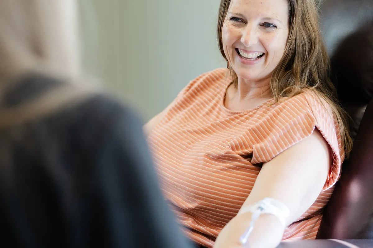A client relaxing during an IV therapy appointment at Abundant Life Wellness Center