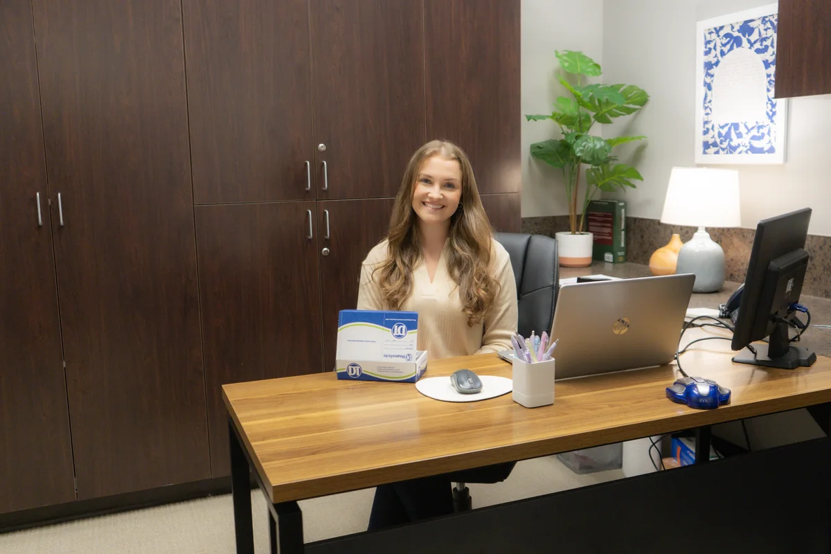 Our nutritionist at her desk with the at-home saliva test kit