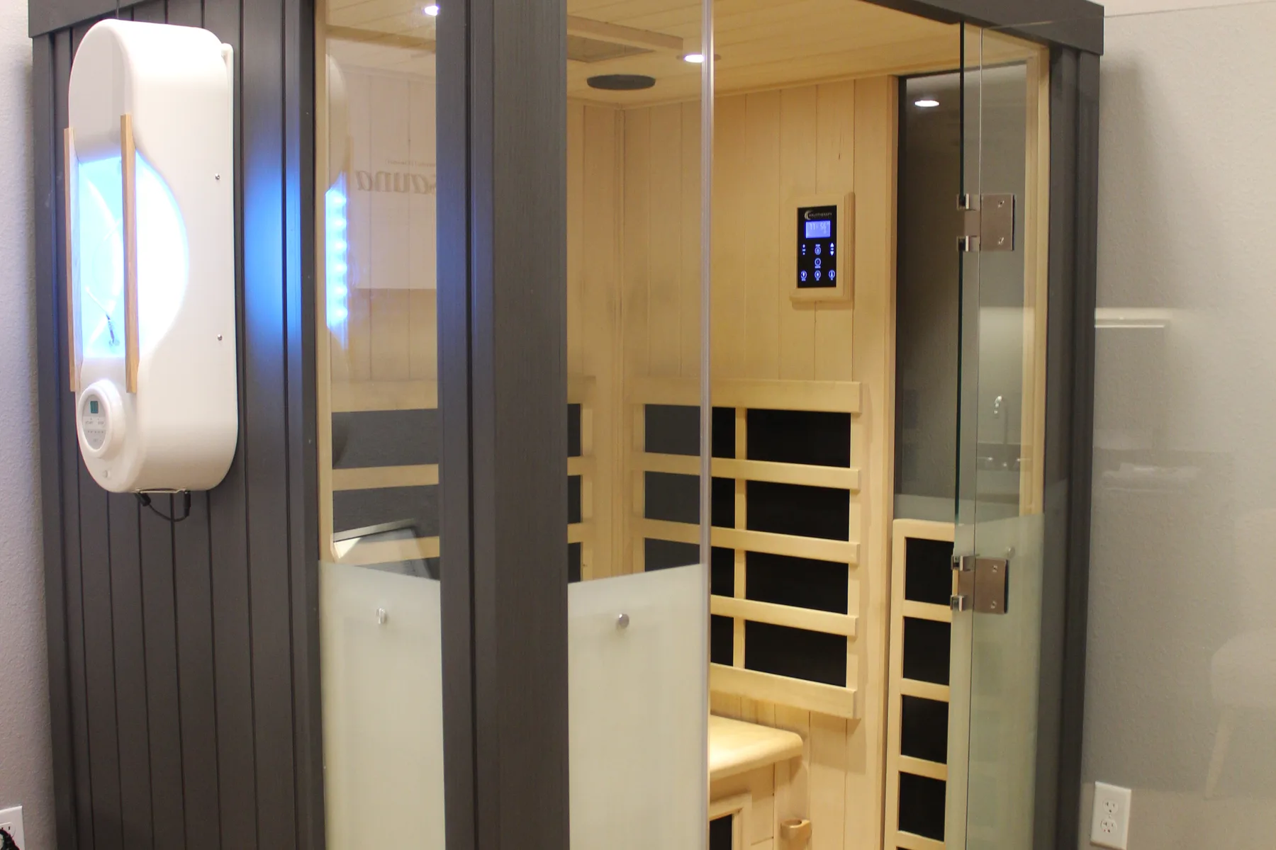 The Halo infrared sauna cabin, halotherapy generator mounted at its side