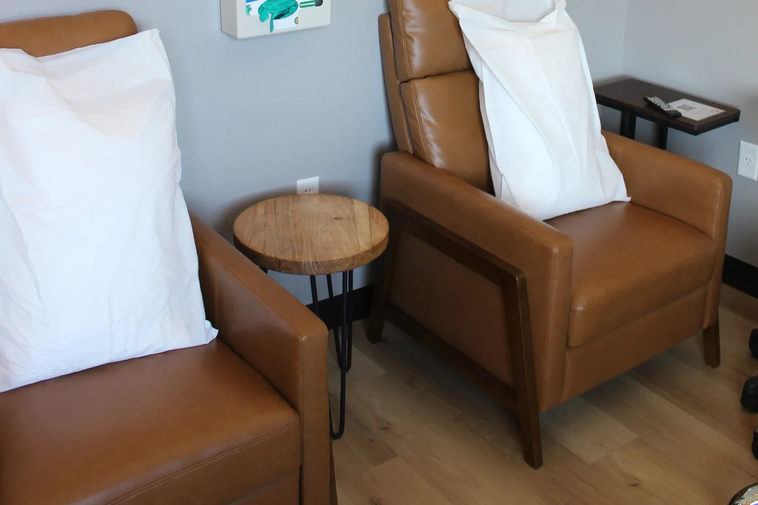 The IV room: two leather recliners with white pillows
