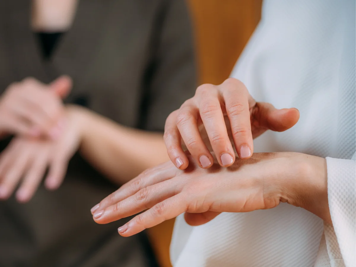 Tapping on the side of the hand during an EFT session